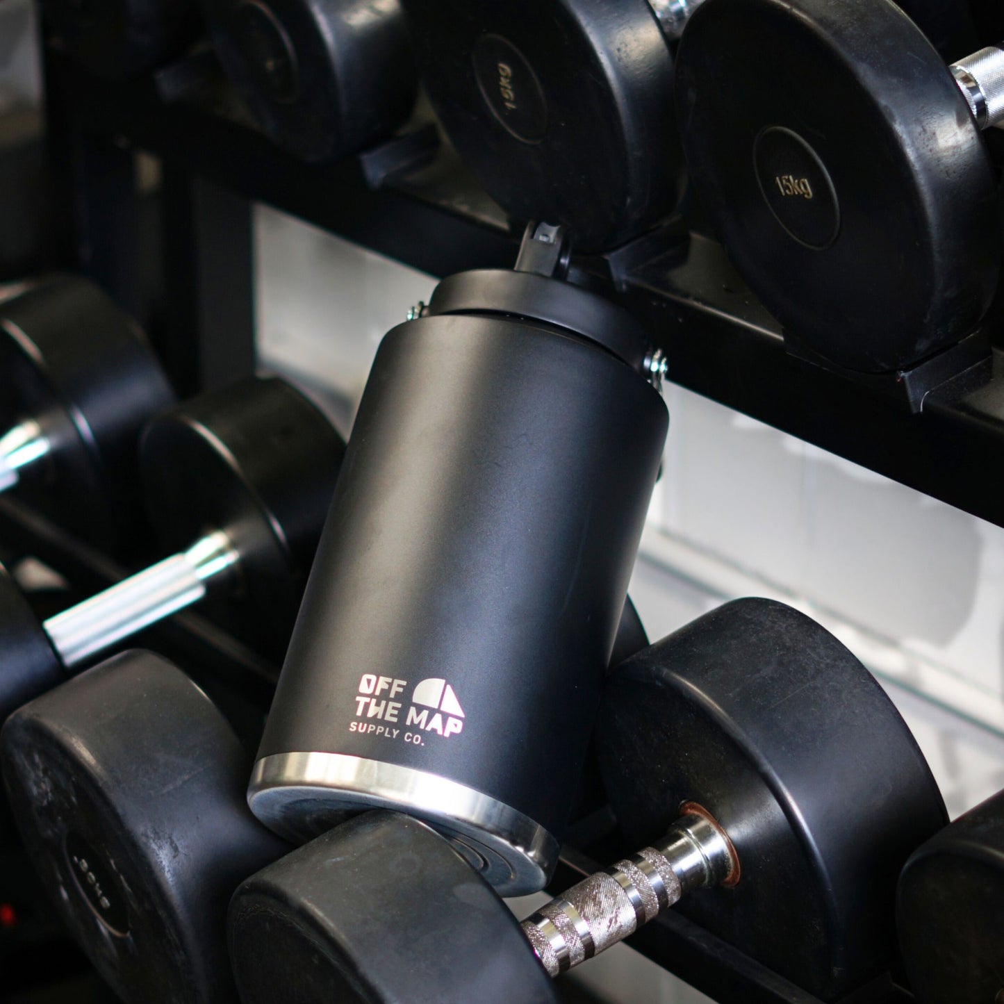 3.5L insulated drinkware in a gym weight rack